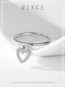 Detailed close-up of 925 silver ring featuring a hollow heart charm with pavé zircons