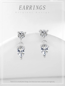 Gros plan des boucles d'oreilles goutte en argent 925 avec zircons en forme de poire