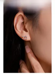 Macro shot of S925 sterling silver tassel earrings with micro-set zircon on model