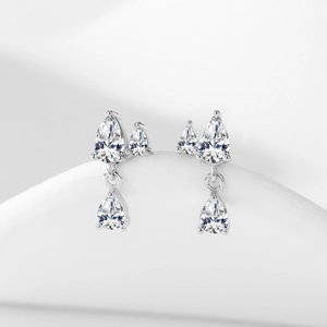 925 silver stud earrings with sparkling pear-cut zircon tassels on a white background
