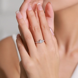 Pear-cut faux diamond ring in 925 sterling silver with micro-pave setting on hand