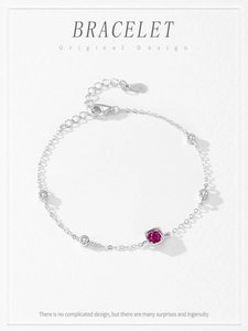 Detail view of S925 silver bracelet featuring pink square sugar stone and zircons