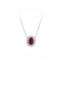 Detailed view of oval ruby pendant with halo of white zircons on 925 silver chain
