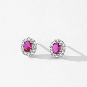 Luxury 925 sterling silver stud earrings featuring oval red zircon and diamond halo