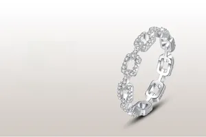 Macro shot of S925 sterling silver chain ring with pavé diamonds and hallmark detail