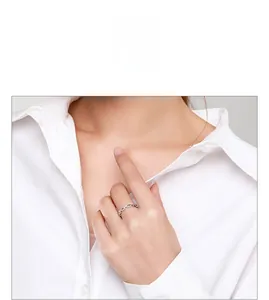 Close-up of S925 sterling silver chain ring with pave crystals on model's finger
