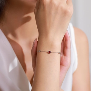 Elegant 925 sterling silver bracelet with a square red gemstone and sparkling accents