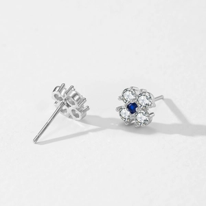 Elegant 925 sterling silver four-leaf clover stud earrings with blue and clear zircon stones