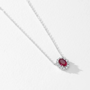 Elegant 925 sterling silver necklace with oval ruby pendant and white crystal accents
