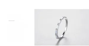 Macro shot of 925 silver ring featuring rectangle cut stones and polished finish