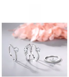 Detail of four S925 sterling silver rings with cubic zirconia in various elegant cuts