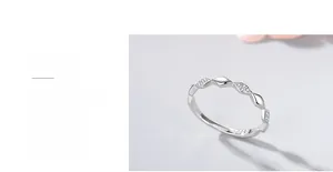 Detailed view of polished 925 sterling silver twist ring with micro-set zircon stones