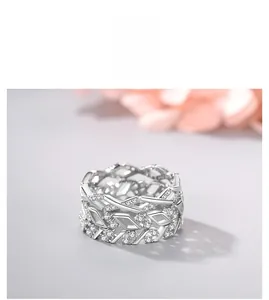 Macro shot of wide S925 silver wave ring with pavé crystals and woven hollow design