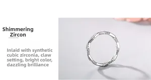 Detail of cubic zirconia stones set in a sterling silver wavy ring with claw setting