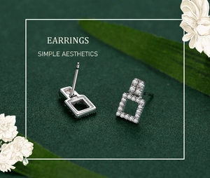 Detail of square hollow silver earrings with S925 hallmark and sparkling cubic zirconia