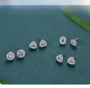 Detail view of s925 sterling silver stud set with heart and geometric zircon stones