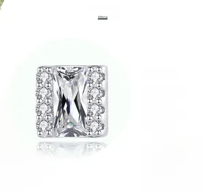 Detailed macro view of square S925 silver stud earrings with micro-inlaid clear zircon stones