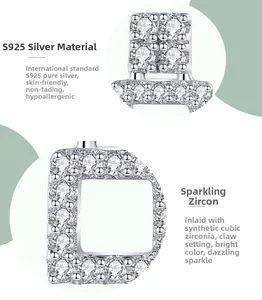 Detailed macro view of S925 sterling silver D-shaped earring with pavé-set cubic zirconia