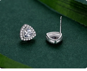 Detail of S925 sterling silver triangle stud earrings with shimmering halo crystals