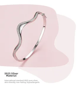 Detailed view of S925 sterling silver wavy bangle with micro-pave cubic zirconia accents