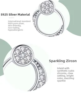 Detail of S925 sterling silver moon stud earrings with prong-set cubic zirconia stones