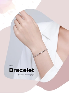 Detail of s925 silver bamboo-style open bracelet with micro-pave white zircon stones