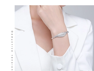 Detail of s925 silver leaf bracelet with micro-pave cubic zirconia on a model