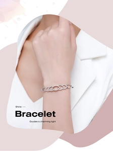 Close-up of S925 silver chain bracelet with marquise links and pavé set crystals