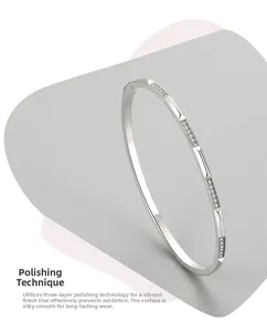 Detail of s925 silver cuff with micro-pave zircons and triple-layer polished finish