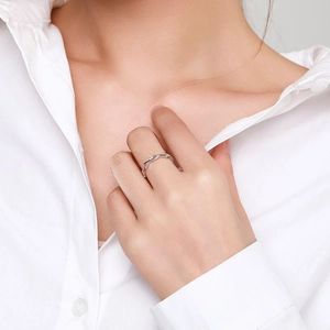 Elegant s925 silver wavy ring with inlaid zircons worn on model in daily setting