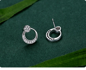 Detailed view of S925 sterling silver moon stud earrings with sparkling pave zircon settings