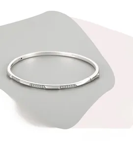 Close-up of minimalist s925 silver bracelet with micro-pave cubic zirconia setting