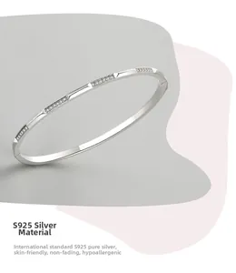 Detailed macro of S925 sterling silver slim bangle with micro-paved cubic zirconia accents