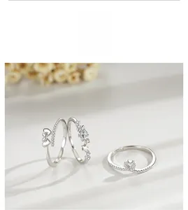 Detailed view of three S925 sterling silver rings with star and heart zircon inlays