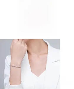 Close-up of elegant S925 silver micro-pave cuff bracelet on a female model wrist