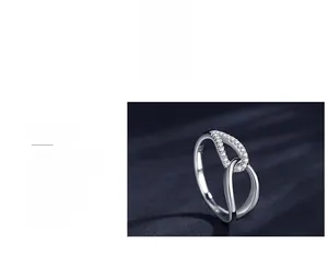 Detail of s925 silver ring featuring a crossed hollow design and micro-pave zircons