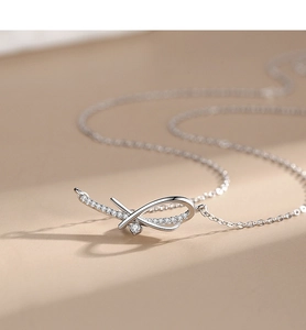 Detailed close-up of 925 silver infinity necklace with micro-pave crystals and center stone