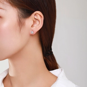 S925 sterling silver square zirconia stud earrings worn by a model in a minimalist style