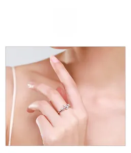 Detail of s925 silver leaf ring with micro-set zircons worn on finger for daily style