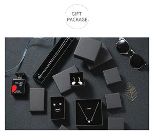 Elegant black jewelry gift box set with silver necklace and ring on velvet lining