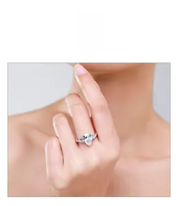 Close-up of S925 silver ring featuring a pear-cut centerpiece and three-stone design