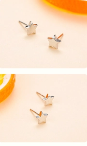 Détail macro de boucles d'oreilles étoile en argent S925 poli avec finition miroir brillant