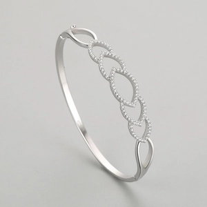 Luxurious S925 sterling silver hollow heart bangle with micro-pave white zircon stones