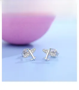 Detail of s925 silver airplane earrings with small cubic zirconia inlays and 925 stamp