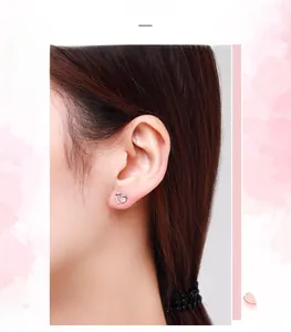 Close-up of s925 sterling silver heart stud earrings with sparkling zircon crystals