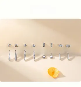 Detail view of various S925 silver star and geometric earrings with sparkling zircon stones