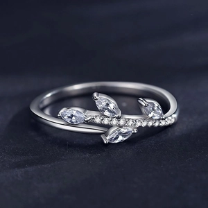 S925 silver leaf ring with marquise-cut crystals and pavé accents on dark background