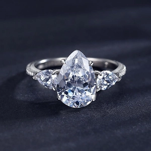 Sparkling S925 sterling silver ring featuring a pear-cut main stone with side accents