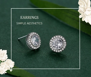 Macro shot of silver round halo stud earrings with sparkling cubic zirconia stones