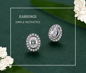 Detailed close-up of S925 silver oval halo earrings on an elegant green background